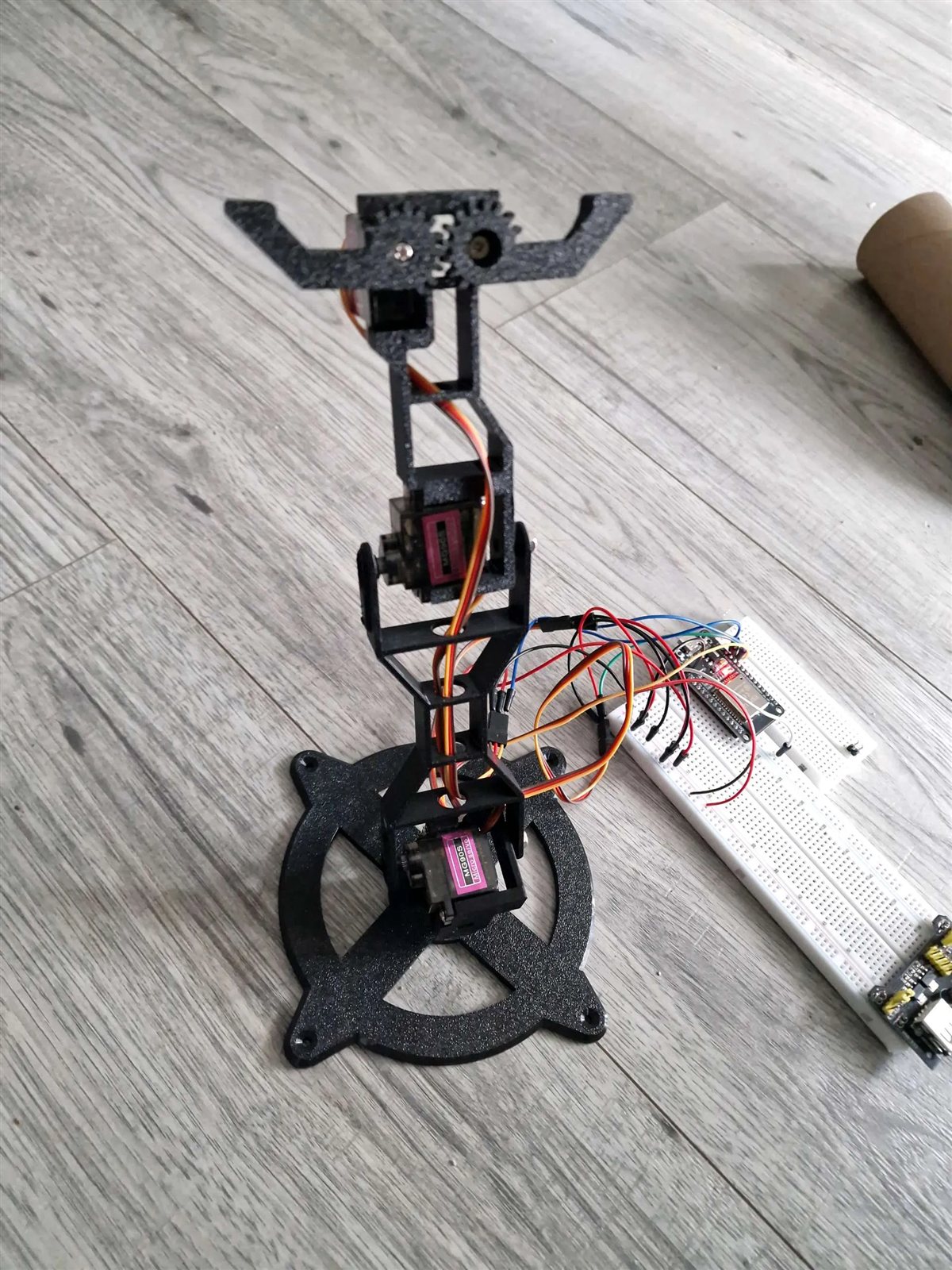 Printed Servo Mini Arm connected to a breadboard-based joystick control circuit