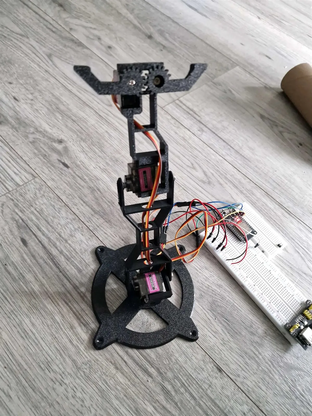 Printed Servo Mini Arm connected to a breadboard-based joystick control circuit